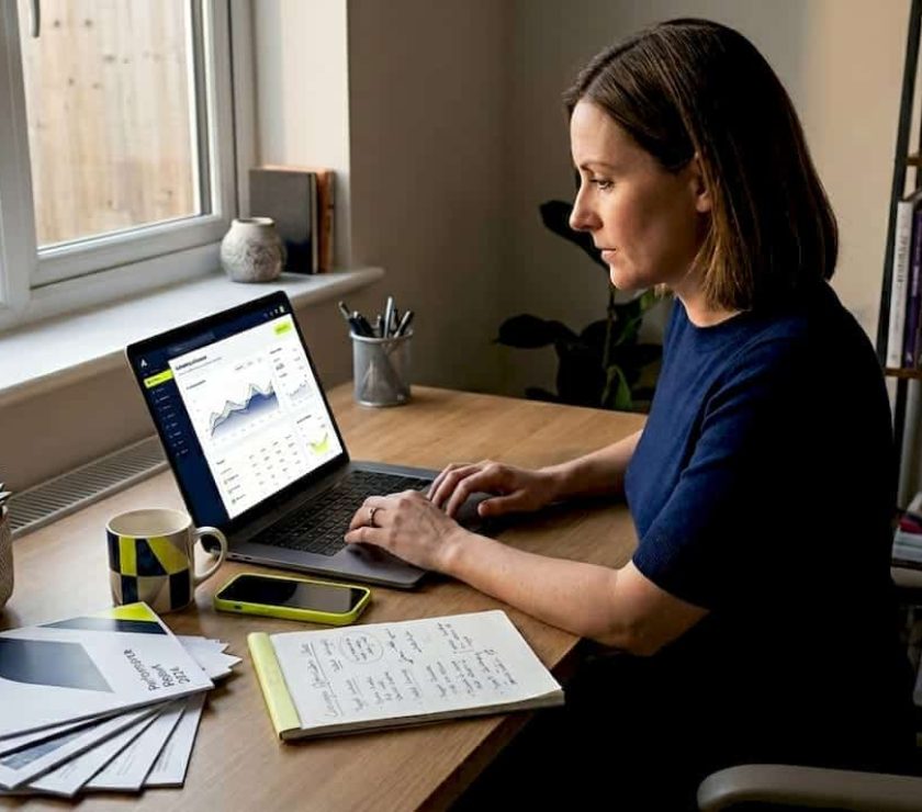 UK SME owner working on digital marketing tasks