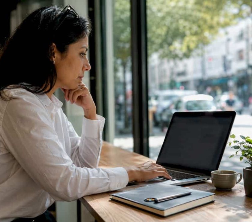 Woman working on website analytics in SME office
